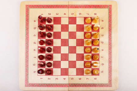 Chessboard with placed pieces. View from above.