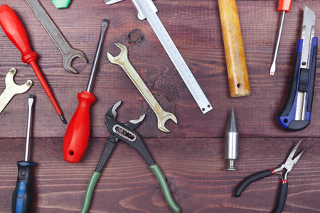 New and old bench tools for repair work on a wooden workshop. view from above.の写真素材