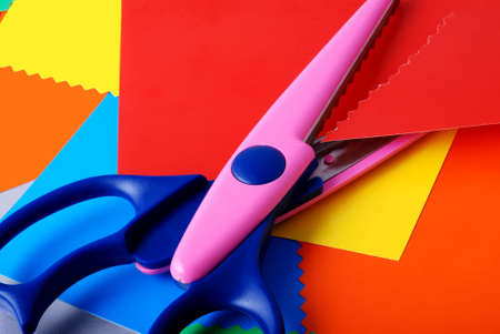 many colourful paper, cutting out scissorsの写真素材