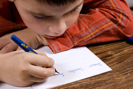 boy writes a letter to Santa