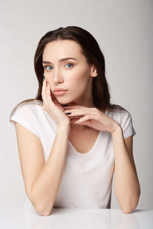 woman girl with fruits on gray white backgroundの写真素材