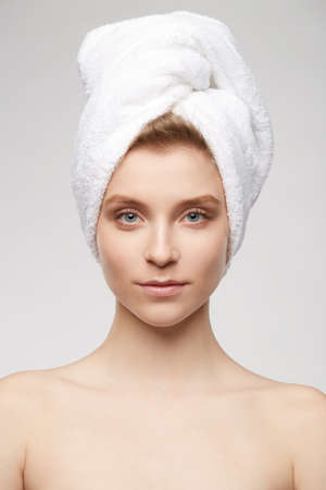 Woman at the spa gray background whiteの写真素材