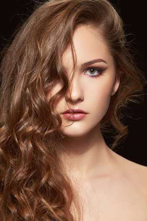 Beauty portrait of woman with curly hairの写真素材