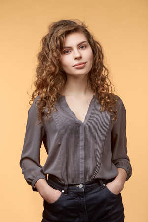 woman with apple biege backgroundの写真素材