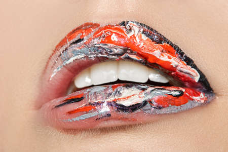 woman beauty lips in paint close up