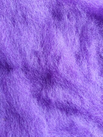 lilac texture woolen background. abstract textile background of carded wool for needle felting in light purple colorの写真素材