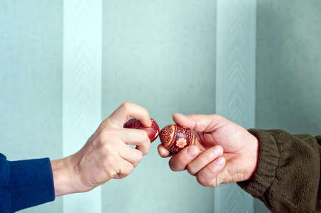 tapping the Easter eggs - polish Easter custom tradition  egg knocking game  Egg tapping game or egg fight illustration の写真素材