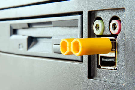 face of computer concept  eyes - headphones and microphone plugs, nose - pendrive, mount - usb portの写真素材