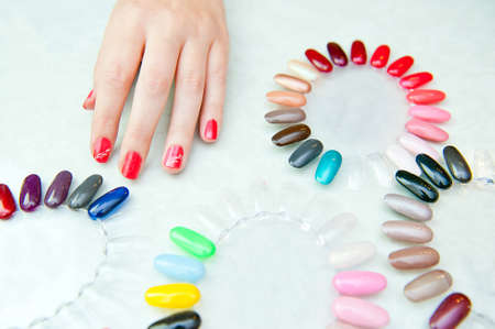 Hand and palette of colorful nails patterns の写真素材