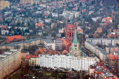 church tower and flats in city of Wroclawの写真素材