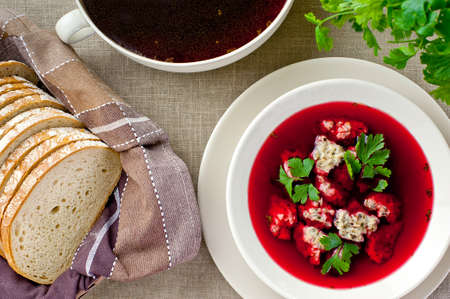red borsch soup with green parsley