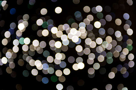 blurred, defocused bright lights on black background