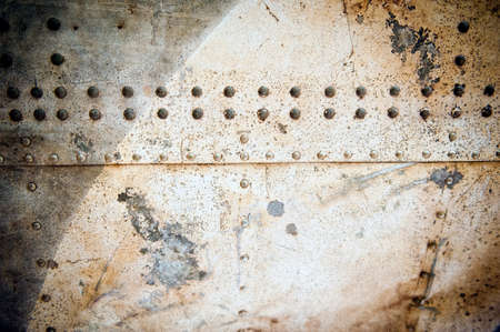 grained abstract industrial metal plates with rivetsの写真素材