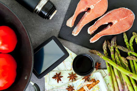 traveling and cooking concept. International cuisine set: map, thermos and food ingredientsの写真素材