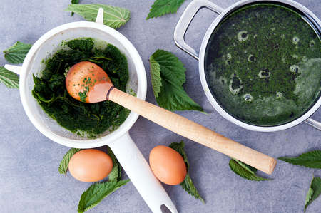 making vegetarian, healthy nettle soupの写真素材