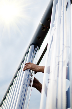 Man installing solar collector tube. They are used to collect energy.の写真素材