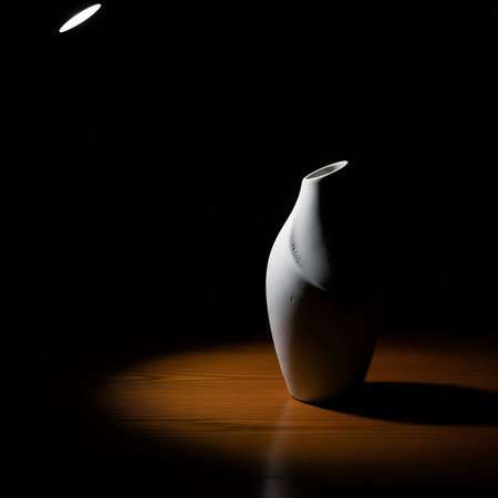 Ceramic vase on a dark background with a spotlight.の素材