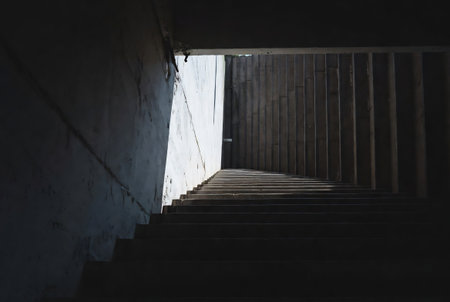 Concrete stairs in a modern building with light coming from the endの素材