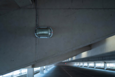 CCTV camera on the ceiling of the building in the cityの素材
