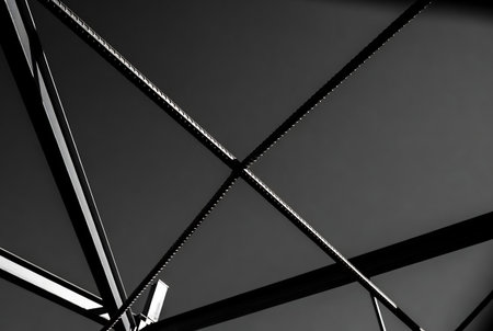 Metal structure of a bridge, close-up. Black background.の素材