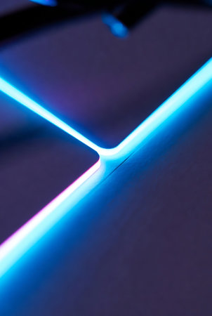 blue neon light on a black background, close-up of photoの素材