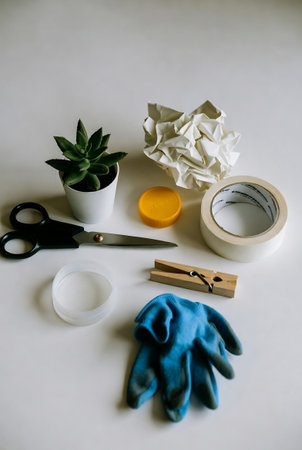 scissors, gloves, tape measure and plant on a white backgroundの素材