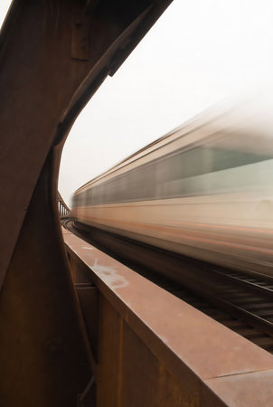 Train moving fast on the bridge in foggy day, motion blurの素材