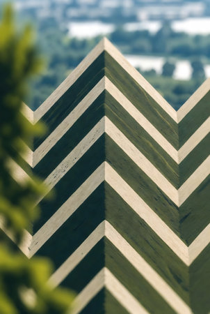 Close-up of the top of a wooden building with a green backgroundの素材
