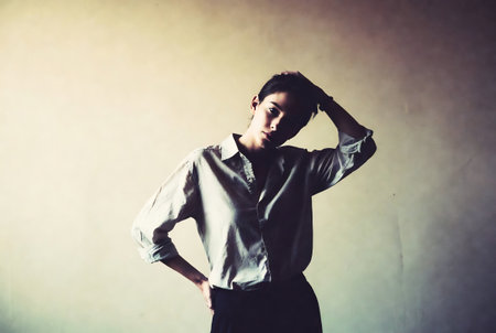 Portrait of a beautiful young woman in a black skirt and shirtの素材