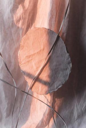 Crumpled paper with shadow on the wall. Abstract background.の素材