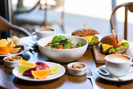 Breakfast with coffee and sandwich on table in cafe, stock photoの素材