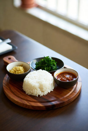 Rice and curry on the wooden table in the restaurant, stock photoの素材