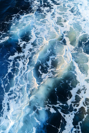 Blue sea water with waves and foam. Abstract background. Texture.の素材