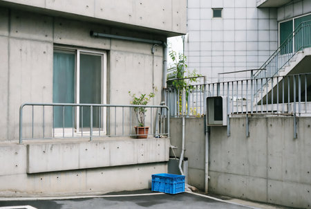 Close up view of a modern apartment building with a blue basket.の素材