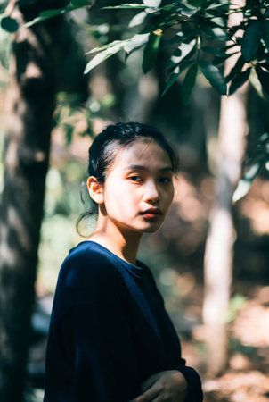 Portrait of Asian woman in the forest. Selective focus.の素材