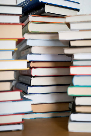 Pile of books on the table. Education and learning concept.の素材