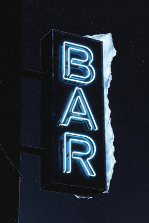 Neon signboard on a dark background. Signboard with the inscription Bar.の素材