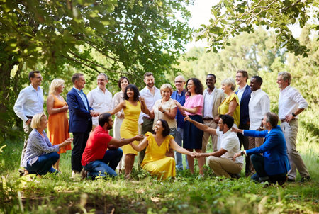 Group of senior people having fun in the park during a dance classの素材