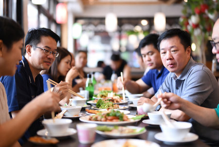 Group of asian people eating in a restaurant. Asian people eating in a restaurant.の素材