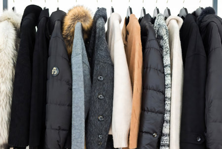 Women's clothing on hangers in the store. Women's clothing.の素材