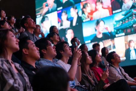 Unidentified people listen to the news on the stage.の素材