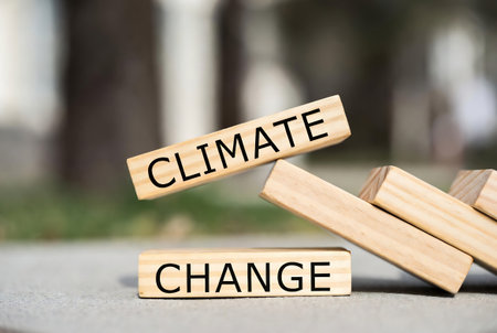 Closeup of wooden blocks with CLIMATE CHANGE text on topの素材