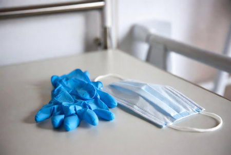Medical mask and gloves on the table in the hospital. Medical conceptの素材