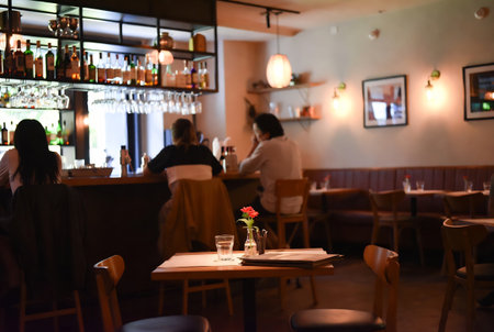 Cafe interior with empty tables and chairs, shallow depth of fieldの素材