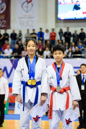 Unidentified children compete in taekwondo championship in Bangkok, Thailand.の素材