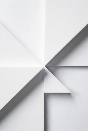 White paper folded in a triangle on a white background. Abstract background.の素材