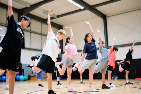 group of young asian people exercise fitness and aerobic in gym classの素材