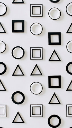 Abstract pattern of black and white geometric shapes on a white background.の素材