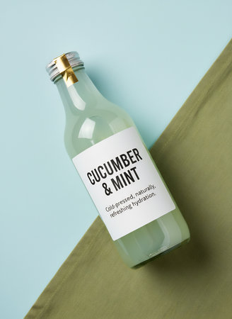 High angle view of a bottle of cucumber sanitizer on tableの素材