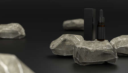 Black dropper pipette bottle mockup on black background with rocks. CBD oil dropper bottle. Serum dropper botlle. Vape liquid in brown glass bottle.の写真素材